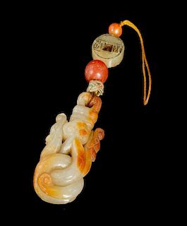 A Celadon and Russet Jade Pendant Length 2 1/2 inches.