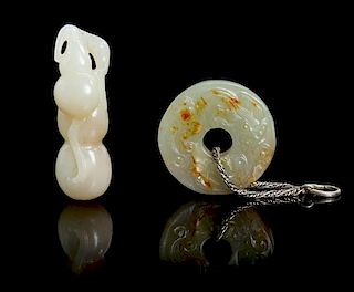 Two Celadon Jade Pendants Length of larger 2 inches.