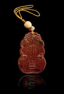 A Goldstone Glass Pendant Length 2 7/8 inches.