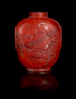 * A Carved Red Agate Snuff Bottle Height 3 inches.