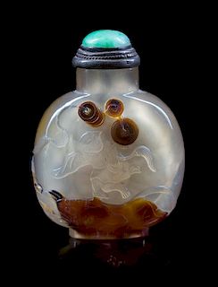 A Carved Agate Snuff Bottle Height 2 1/2 inches.