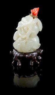 * A Carved Pale Celadon Jade Snuff Bottle Height 2 1/2 inches.