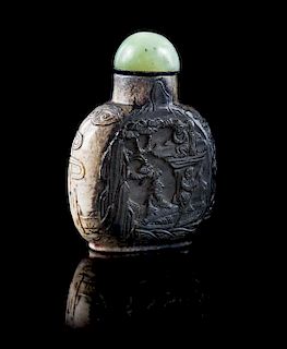 * A Carved Chicken Bone Jade Snuff Bottle Height 3 inches.