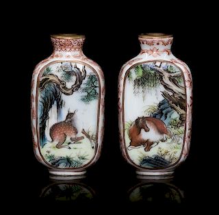 A Pair of Polychrome Enamel Porcelain Snuff Bottles Height of each 2 1/2 inches.