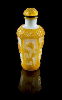 * A Yellow Overlay White Peking Glass Snuff Bottle Height 2 3/4 inches.