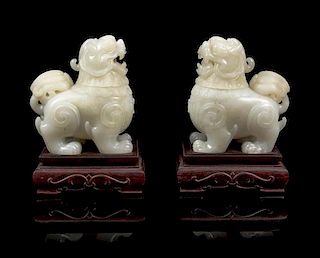 * A Pair of Chinese Near White Jade Censers Height of figure 3 3/4 inches.