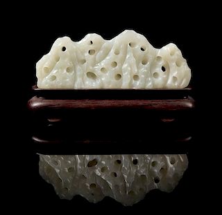 * A Chinese White Jade Brush Rest Width 5 3/4 inches.