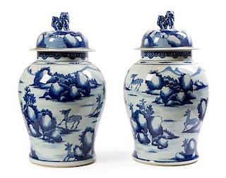 * A Pair of Chinese Blue and White Porcelain Vases and Covers Height 22 1/2 inches.