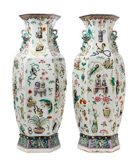 * A Pair of Chinese Famille Rose Molded Porcelain Vases Height 25 1/8 inches.