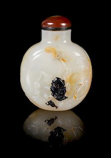 * A Chinese Carved Agate Snuff Bottle Height 3 1/8 inches.