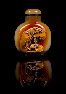 * A Chinese Carved Agate Snuff Bottle Height 2 3/4 inches.