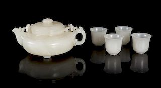 * A Chinese White Jade Teapot and Four White Jade Cups Height of cups 1 3/8 inches.
