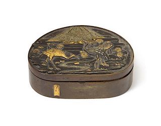 A Gilt Decorated Bronze Pill Box and Cover Length 2 1/2 inches.