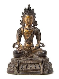 * A Sino-Tibetan Gilt Bronze Figure of a Bodhisattva Height 8 inches.