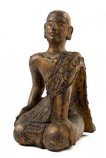 * A Thai Gilt Wood Figure of a Monk Height 15 1/4 inches.