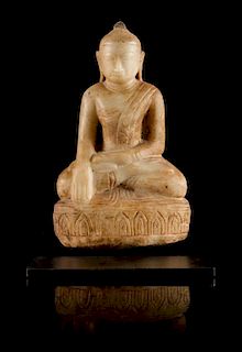 * A Parcel-Gilt White Stone Figure of Buddha Height of figure 11 inches.