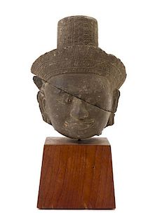 * A Khmer Limestone Head of Buddha Height 9 inches overall.