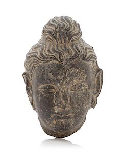 A Small Gandharan Grey Schist Head of Buddha Height 5 1/4 inches.
