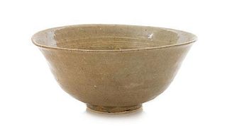 * A Korean Celadon Glazed Stoneware Bowl Height 3 1/4 x diameter 7 1/2 inches.