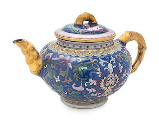 A Polychrome Enameled Yixing Teapot Width over handle 6 1/2 inches.