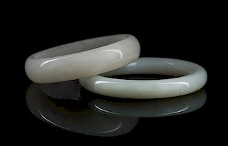 Two Celadon Jade Bangles Diameter of larger 3 1/4 inches.