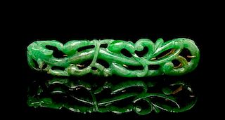 A Chinese Gold Mounted Pierce Carved Jadeite Brooch Length 2 1/4 inches.