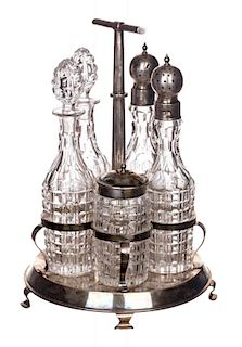 A RUSSIAN SILVER AND CUT-GLASS CRUET SET WITH STAND, MARKED JB, ST. PETERSBURG, CIRCA 1881