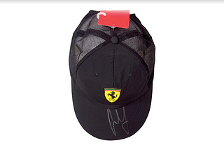 Carlos Sainz Signed Puma Hat *Black w/ Ferrari Logo* (Beckett Hologram)