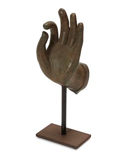 A cast bronze Buddhist-style hand