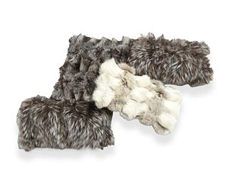 A group of fur pillows