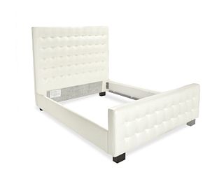 A custom tufted bed