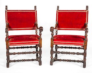 PAIR OF IBERIAN BAROQUE STYLE STAINED WALNUT HALL CHAIRS