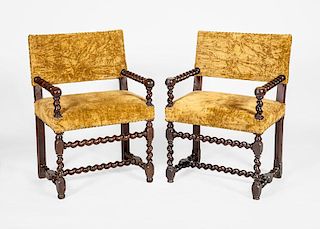 PAIR OF CONTINENTAL BAROQUE STYLE STAINED WALNUT ARMCHAIRS