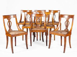 SET OF EIGHT BIEDERMEIER BLACK WALNUT AND CANED SIDE CHAIRS
