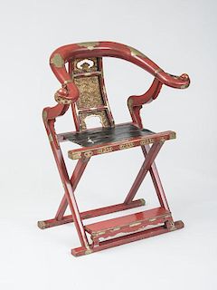 CHINESE BRASS-MOUNTED RED LACQUER AND PARCEL-GILT FOLDING ARMCHAIR