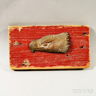Cast Brass Eagle Head Mounted on a Red-painted Board