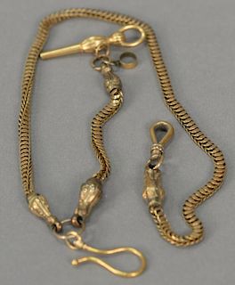 14K gold watch chain end with serpent head. 
33.3 grams