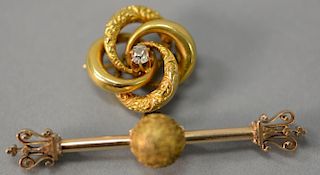 Victorian 14K gold pin with 18k scrolled brooch set with center diamond. 
15.9 grams