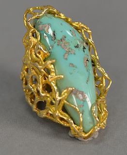 14K gold ring set with large turquoise stone. 
lg. 2 in.; ring size 7