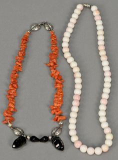 Two coral necklaces.
white coral: lg. 19 1/2 in.
