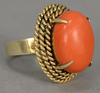 18K gold ring set with cabachon cut coral. 
ring size 6 1/2 in. 9.6 grams total weight