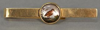 14K gold tie clip mounted with round glass with painted shore bird. 
ht. 2 3/4in. 10.2 grams