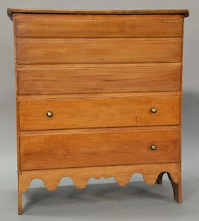 Primitive blanket chest having lift top over three false drawers over two drawers with scalloped skirt all on boot jack ends. 
ht. 4...