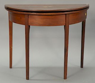 Federal cherry demilune game table, 1/2 round with square tapered legs, circa 1800. 
ht. 28 1/2 in.; wd. 35 1/2 in.; dp. 18 in.