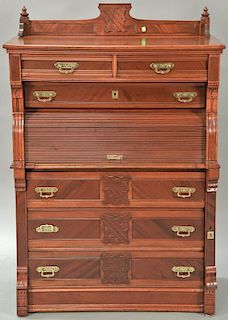 Victorian cherry lockside chest with gallery top having two short drawers over one long drawer over roll up door with pull out inter...