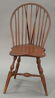 Windsor braced bowback side chair with saddle seat all set on bold turned legs, probably Connecticut 18th century. 
ht. 37 in.; seat...