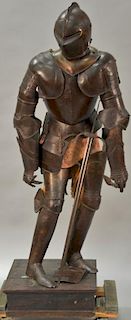 Suit of armor on stand, probably 19th century. 
armor: ht. 66 in.