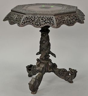 Carved Indian table having pierce carved top over carved shaft with carved snakes and birds all set on tripod base with carved serpe...