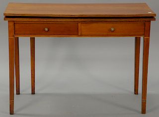Federal cherry game table with rectangular top over two drawers all set on square tapered legs. 
ht. 29 in.; open: 33 1/2" x 41"; cl...