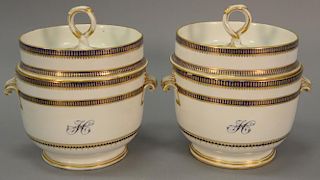 Pair of Royal Crown Derby covered fruit coolers, each with twist handle on deep covers set on tureens with scroll handles, blue and gilt d...
